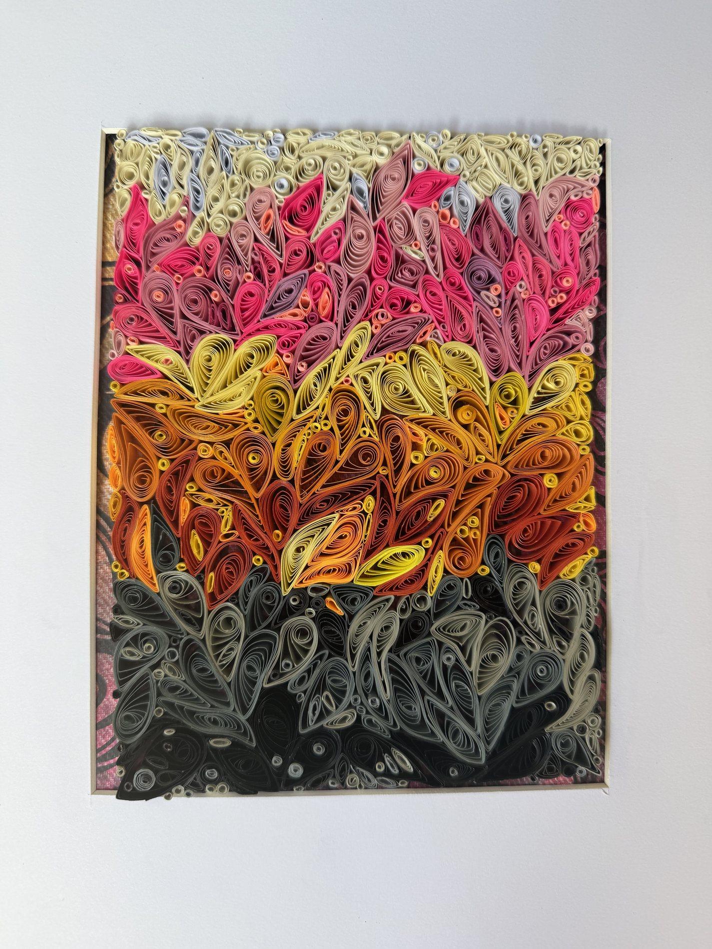 Abstract quilling artwork with layered cream, pink, orange, and charcoal paper shapes